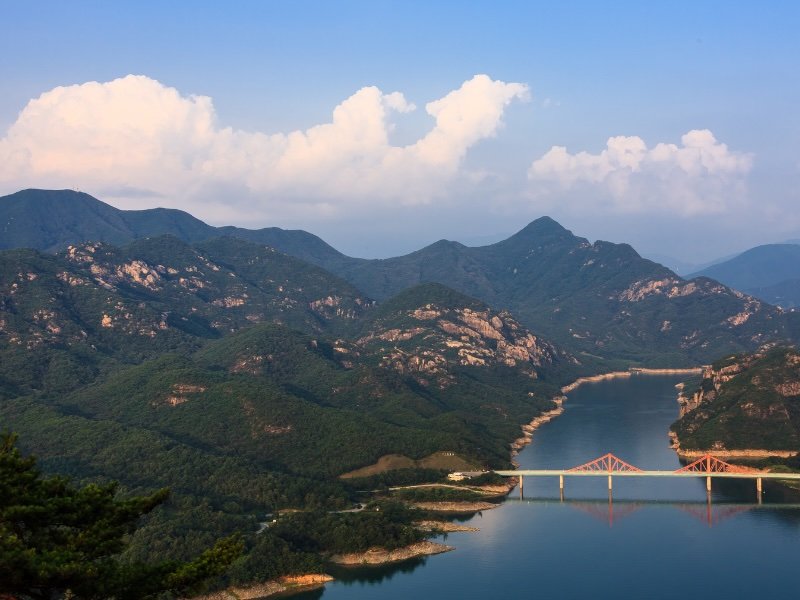 Oksundae Bridge in Jecheon from a high vantage point with majestic views and mountains sprawling in all directions