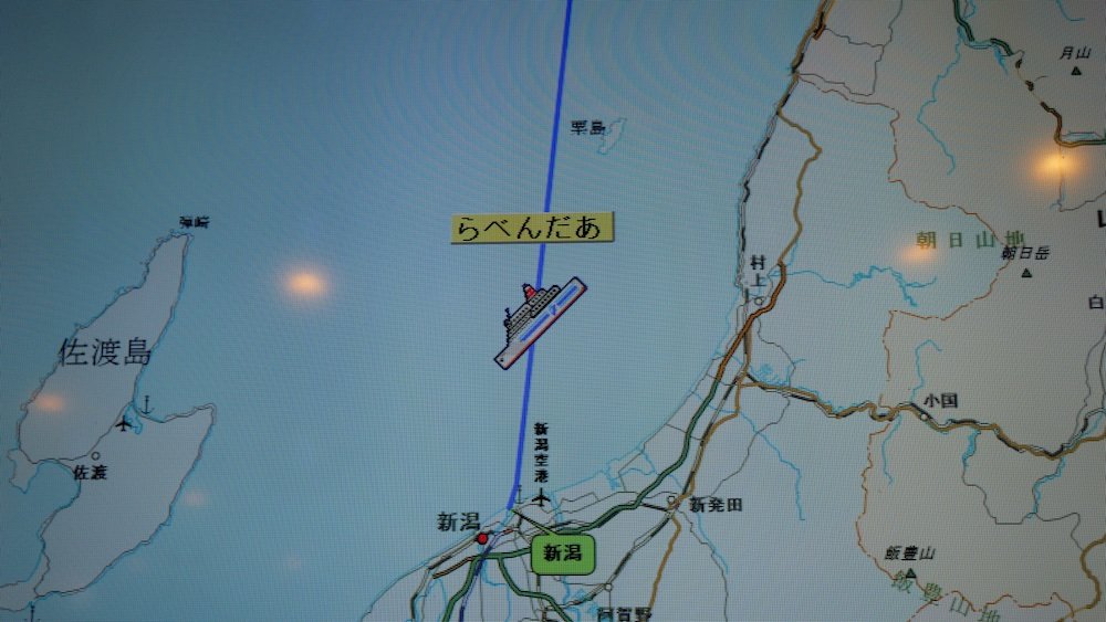 Onboard screen showing the map of Shin Nihonkai Ferry heading from Otaru to Niigata, Japan