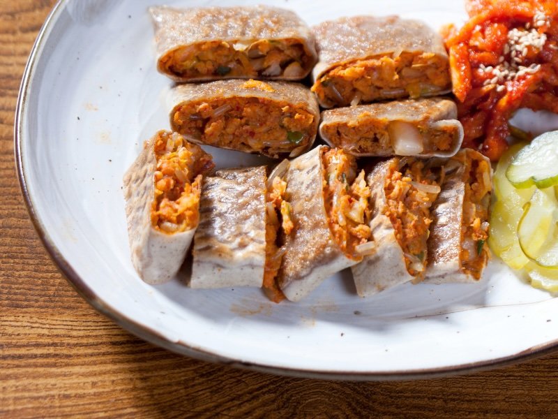 One must-try dish in Jecheon is Memil Jeonbyeong buckwheat crepes filled with a variety of fillings such as seasoned vegetables, kimchi, or minced meat