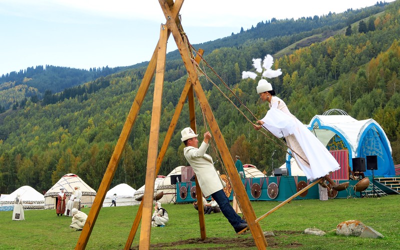 One of the traditional Kyrgyz swings with two people swinging back and forth as part of the festivities