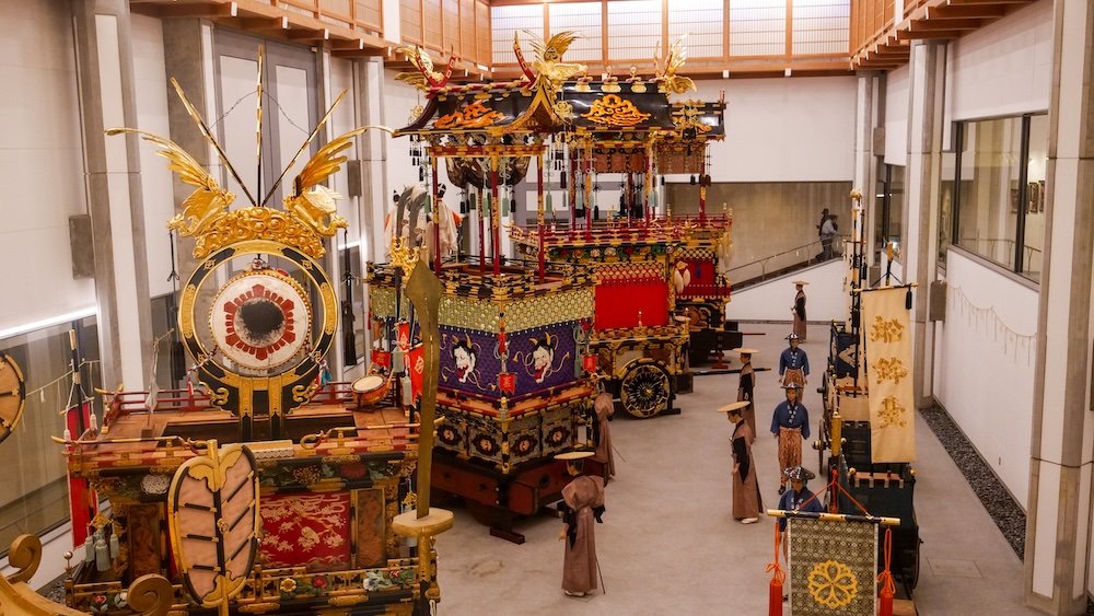 Ornately designed yatai floats outside of the building of the Takayama Matsuri Yatai Kaikan in Japan 