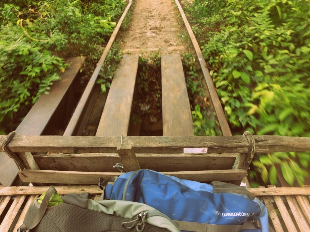 Our backpacks on the bamboo train in Battambang, Cambodia 