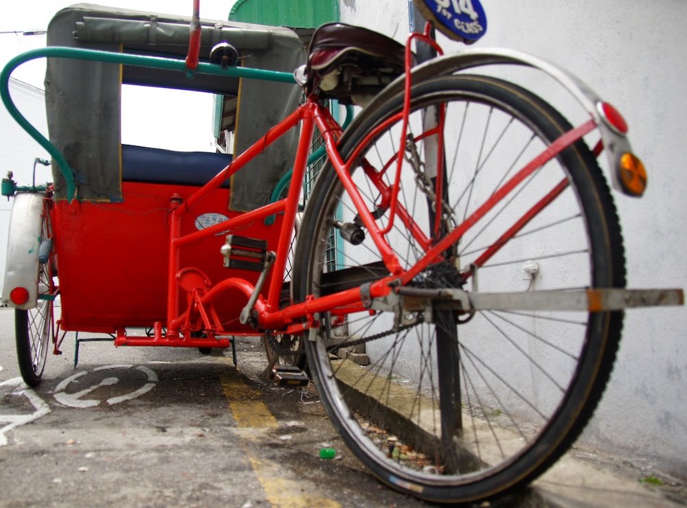 Parked cycle rickshaw on the streets of Penang in Georgetown, Malaysia 