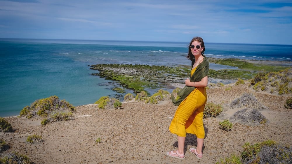 Audrey Bergner Overlooking the Atlantic Coastal Restinga at Península Valdés, Chubut, Patagonia, Argentina Audrey Bergner stands on a scrub-covered coastal bluff overlooking the rocky restinga and turquoise Atlantic waters of Península Valdés in Chubut, Patagonia, Argentina.