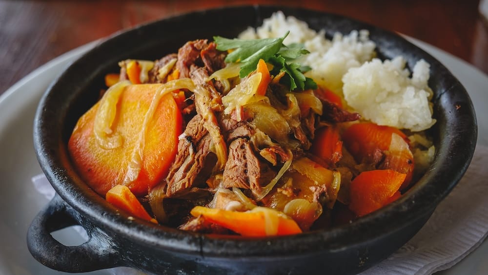 Patagonian lamb stew served in Península Valdés Argentina with tender cordero patagonico, carrots, onions, and potatoes, showcasing a hearty alternative to cordero al asador with higher meat yield and comforting flavors shaped by local ingredients