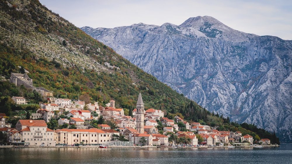 Perast with lake foreground and mountain backdrop in Montenegro 