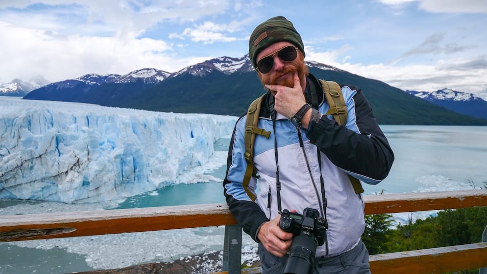 Samuel Jeffery at Perito Moreno Glacier near El Calafate, Santa Cruz, Patagonia, Argentina Samuel Jeffery stands with a camera at a viewpoint overlooking the blue ice formations of Perito Moreno Glacier near El Calafate, Santa Cruz, Patagonia, Argentina.