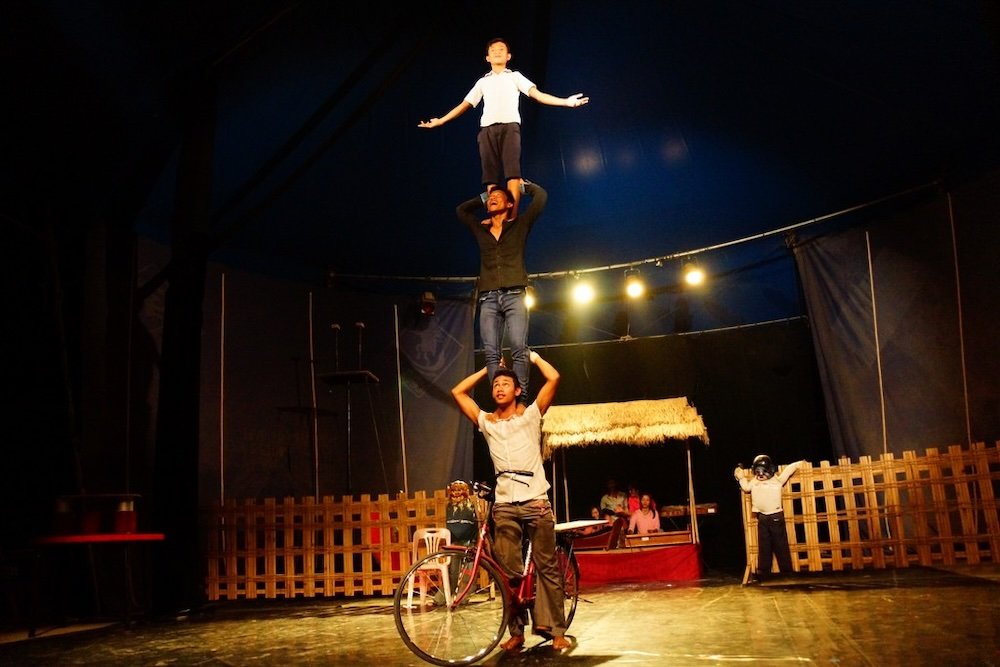 Phare Ponleu Selpak Circus talented performers in Battambang, Cambodia three on top of each other