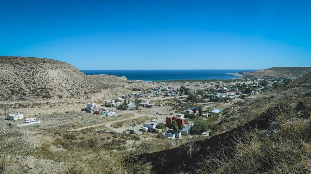 Puerto Pirámides Between the Patagonian Steppe and Atlantic Coast in Península Valdés, Argentina Elevated view over Puerto Pirámides, where a small settlement lies between the dry steppe and deep blue Atlantic waters of Península Valdés, Chubut, Patagonia, Argentina.