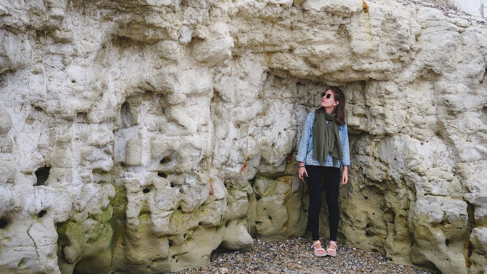 Punta Cuevas Puerto Madryn Patagonia Welsh settlers cave shelter Mimosa arrival site Audrey Bergner Audrey Bergner standing inside natural sandstone caves at Punta Cuevas in Puerto Madryn Patagonia, where Welsh settlers first took shelter after arriving on the Mimosa in 1865, highlighting the harsh environment and survival conditions they faced