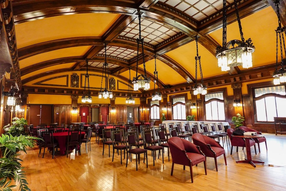 Royal Alexandra Hall interior at the Cranbrook History Centre in Cranbrook, British Columbia, showcasing restored woodwork, arched ceilings, and historic lighting that reflect rescued Canadian railway-era grandeur and elegant heritage architecture.