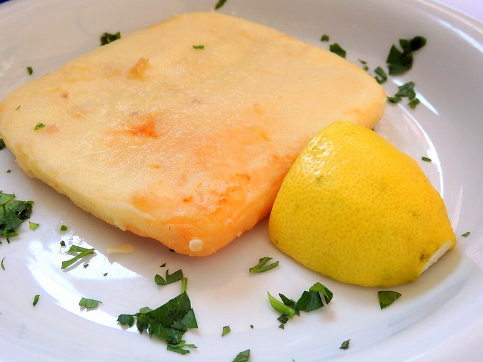 Saganaki, fried Greek cheese, with lemon for lunch