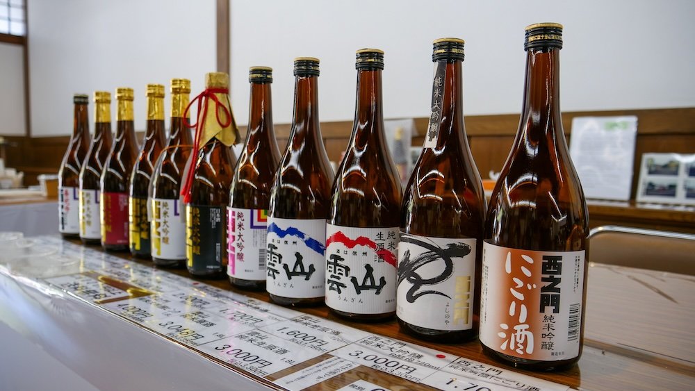 Sake bottles lined up for sale at Nishinomon-Yoshinoya Sake Brewery in Nagano city, Japan 