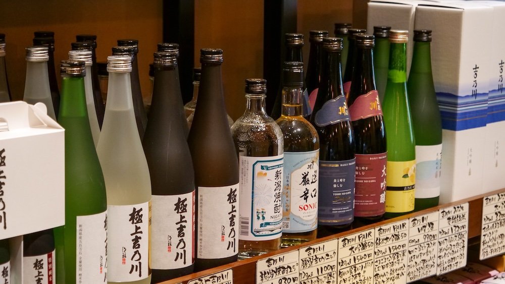 Sake bottles of different sizes and shapes for sale in Japan 