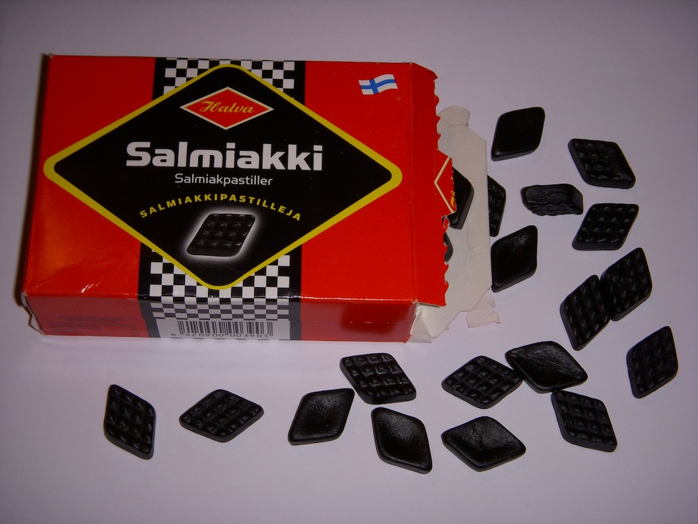 Salmiakki Pastillerja Finnish Candy scattered around on the table