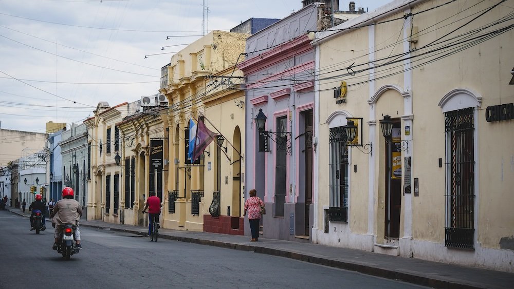 Salta colonial street scene pedestrians and biker in Argentina 