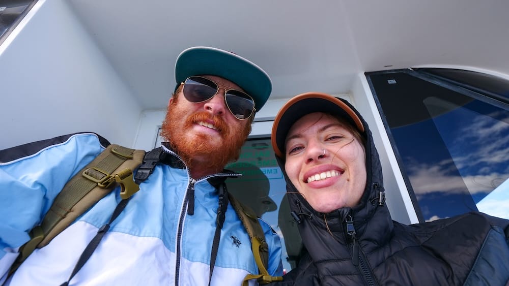 Samuel Jeffery and Audrey Bergner on a Beagle Channel boat tour, Ushuaia, Tierra del Fuego, Argentina Samuel Jeffery and Audrey Bergner smile together aboard a boat during a Beagle Channel wildlife cruise near Ushuaia, Tierra del Fuego, Patagonia, Argentina, both wearing hooded jackets on a windy deck.