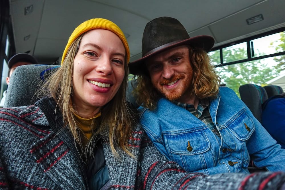 Samuel Jeffery and Audrey Bergner on the Icefields Parkway tour, Banff National Park, Alberta Samuel Jeffery and Audrey Bergner smile together for a selfie aboard a tour bus on the Icefields Parkway in Banff National Park, Alberta, with forested scenery visible through the window behind them.