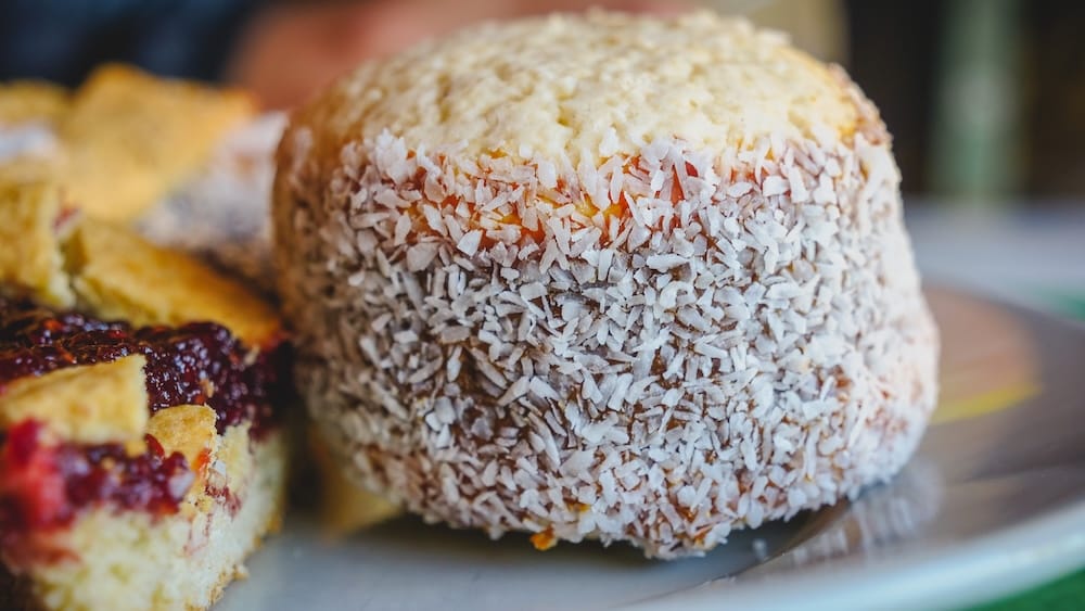 San Martin de los Andes Patagonia Argentina sugary alfajor dessert coated in coconut highlighting how many affordable local snacks and baked goods are heavily sweetened in the region.