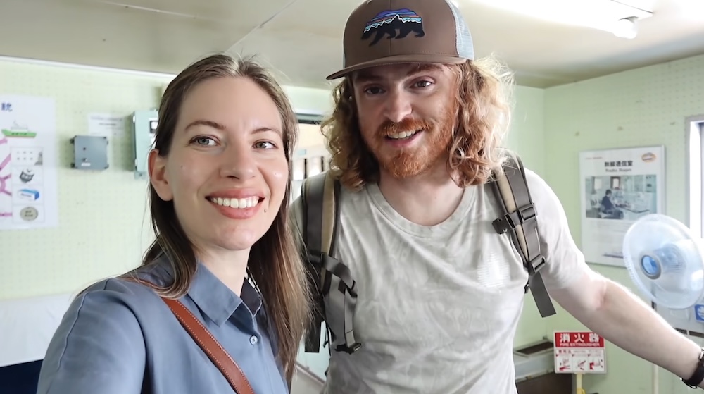 Audrey Bergner and Samuel Jeffery inside the radio room on Mashu-maru, Seikan Ferry Memorial Ship, Hakodate, Hokkaido, Japan Audrey Bergner and Samuel Jeffery smiling inside the pale-green radio communications room of the Seikan Ferry Memorial Ship Mashu-maru in Hakodate, Hokkaido, Japan, with a Radio Room wall poster, ship diagram, and standing fan behind them.