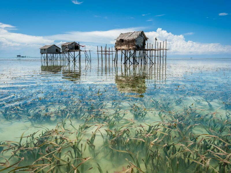 Semporna Travel Guide: Things to do in Semporna, Malaysia with scenic views of stilt houses in the water 