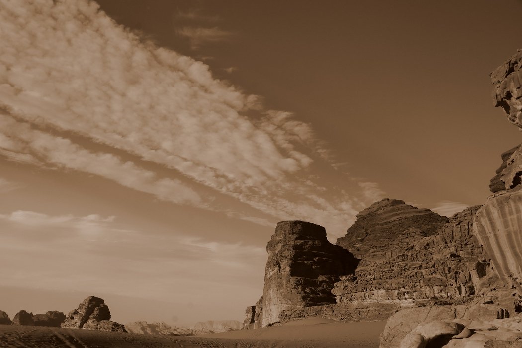 Shot was taken from the back of our pickup truck after it stopped for a few minutes. Looking back I noticed the spectacular cloud formations in the sky visiting Wadi Rum, Jordan