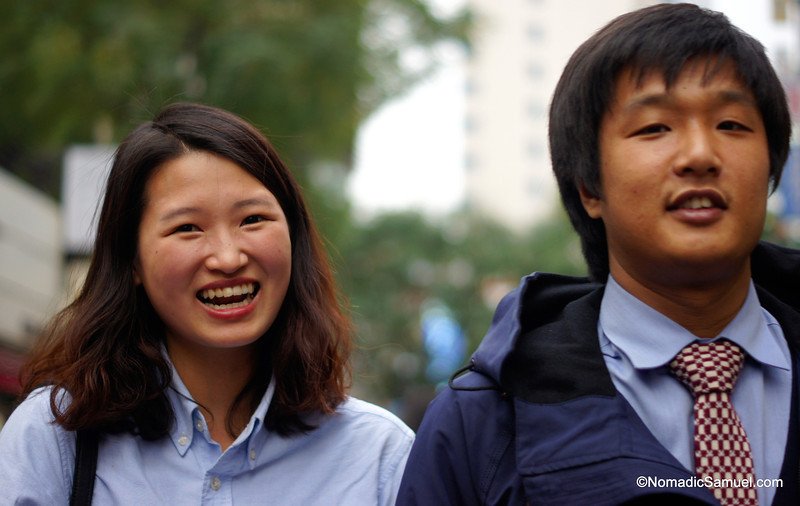 Smiling Koreans with a candid moment on the streets of Insadong located int Seoul, South Korea