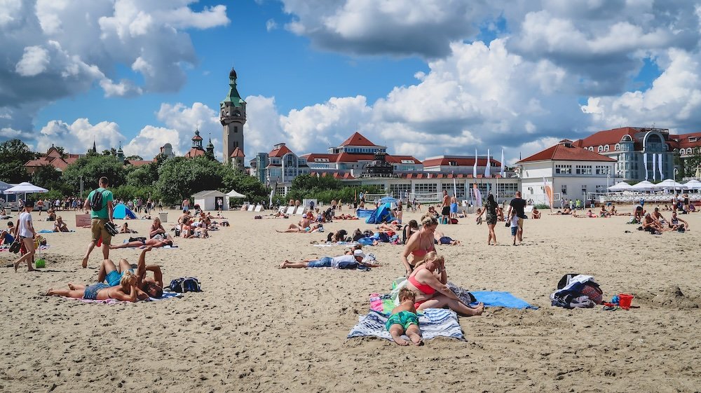 Sopot beachside views with tourists and locals enjoying a sunny day in Sopot, Poland 