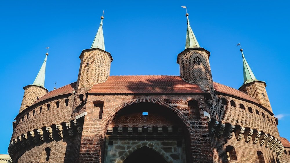 St. Florian’s Gate or Florian Gate Brama Floriańska and the Kraków Barbican Barbakan krakowski in the Old Town of Krakow, Poland