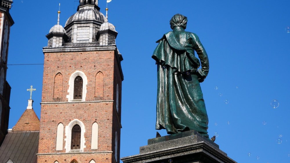 Statue in the Main Square, Kraków Medieval Town Square Rynek Główny in Krakow, Poland