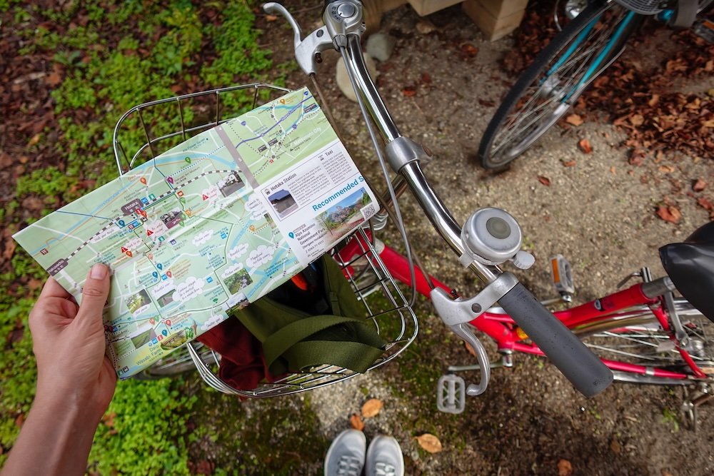 Stopping our bicycle to read our map at Daio Wasabi Farm in Japan