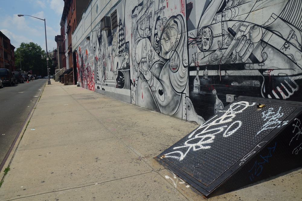 Street art and graffiti mural on a wall in Williamsburg Brooklyn New York City