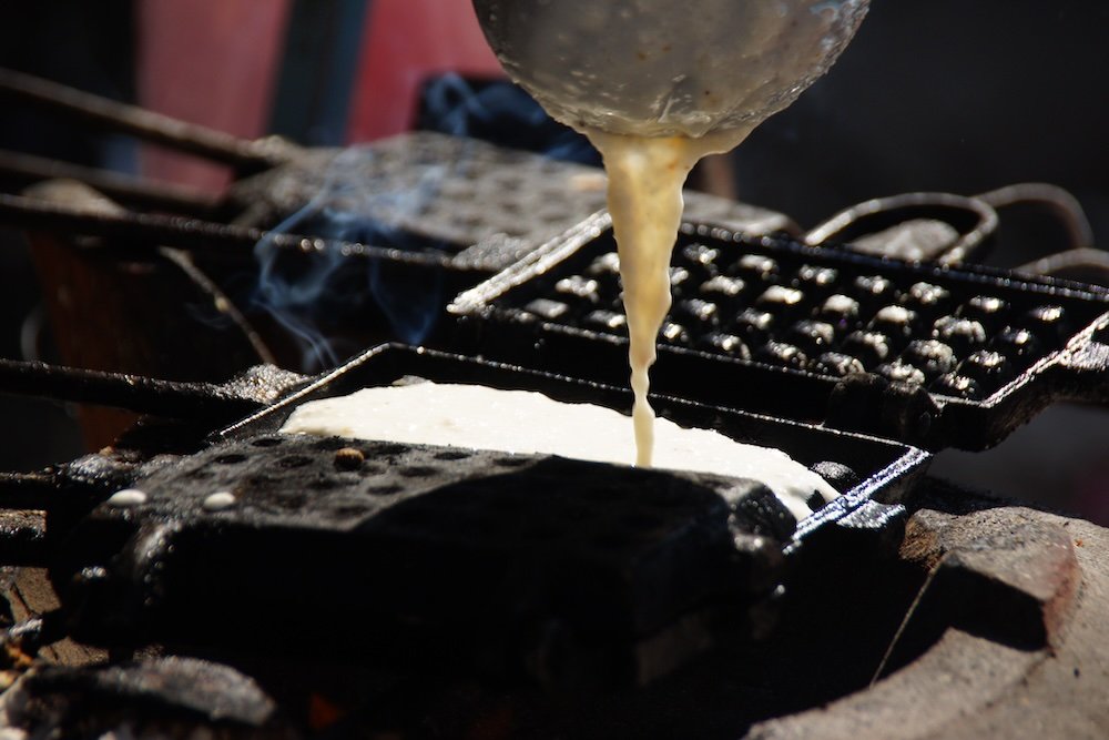 Street food pancake batter cooking in Battambang, Cambodia 