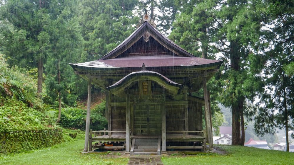 Suwa Shrine with rain pouring down on a day trip from Yuzawa