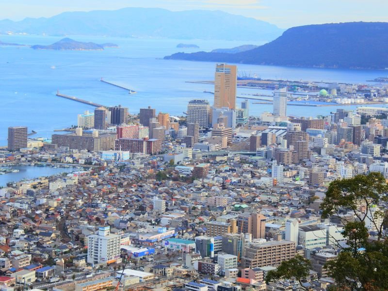 Takamatsu cityscape views from a high vantage point in Japan overlooking buildings and the sea in Japan 