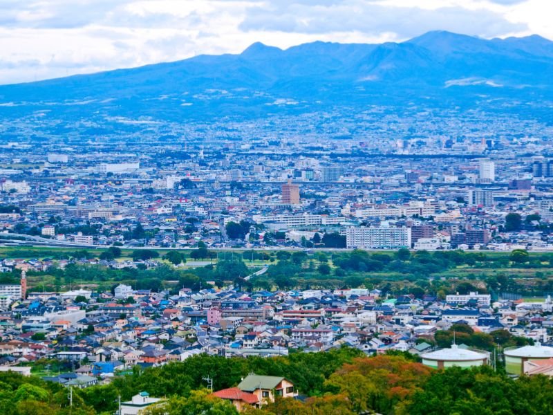 Takasaki city views from a high vantage point with mountain backdrop 