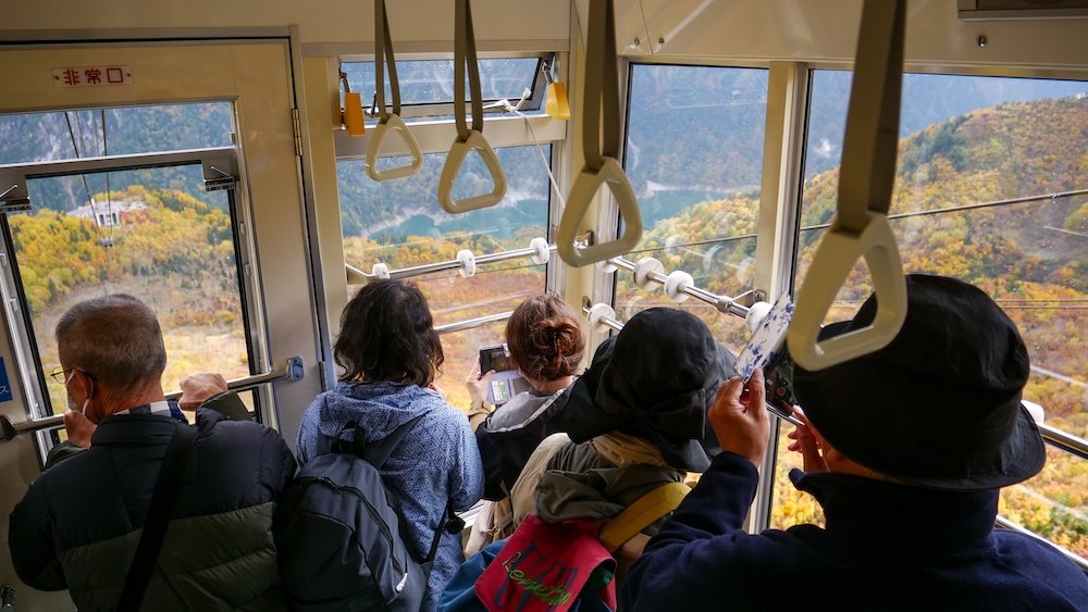 Tateyama Ropeway cable car filled with passengers heading from Daikanbo to Kurobedaira 