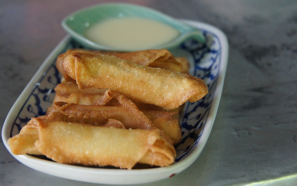 Thai spring rolls with dipping sauce that we made at our Thai cooking class in Chiang Mai, Thailand.