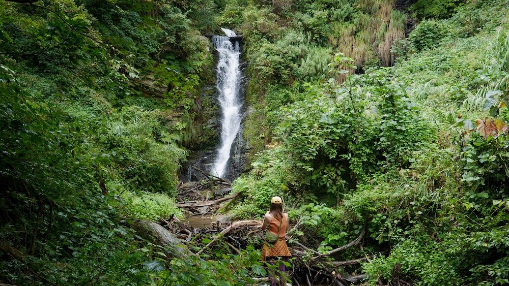 That Backpacker admiring and taking photos of Fudo waterfall in Yuzawa, Japan