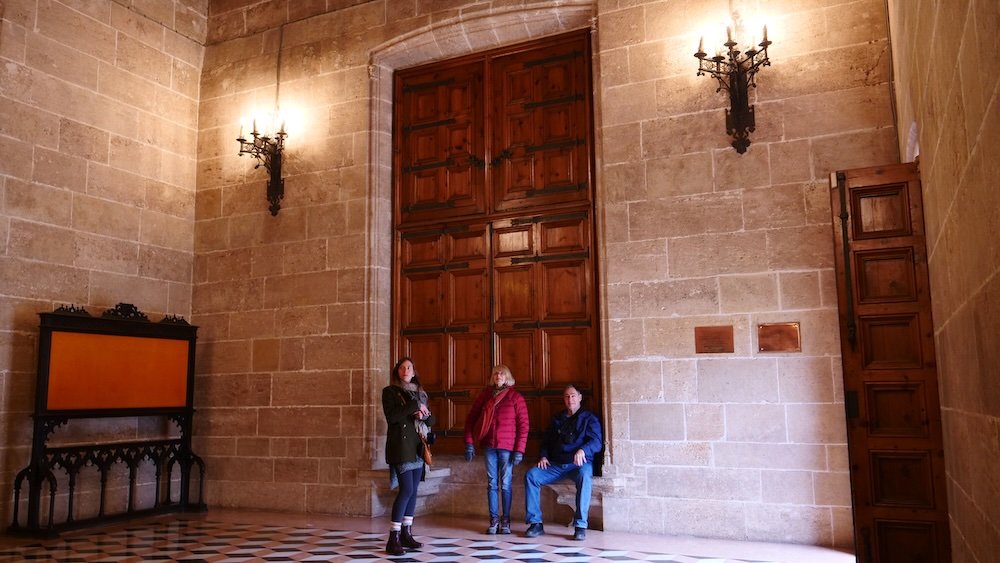 That Backpacker Audrey Bergner and Nomadic Samuel's parents outside of iconic huge door in Valencia, Spain 