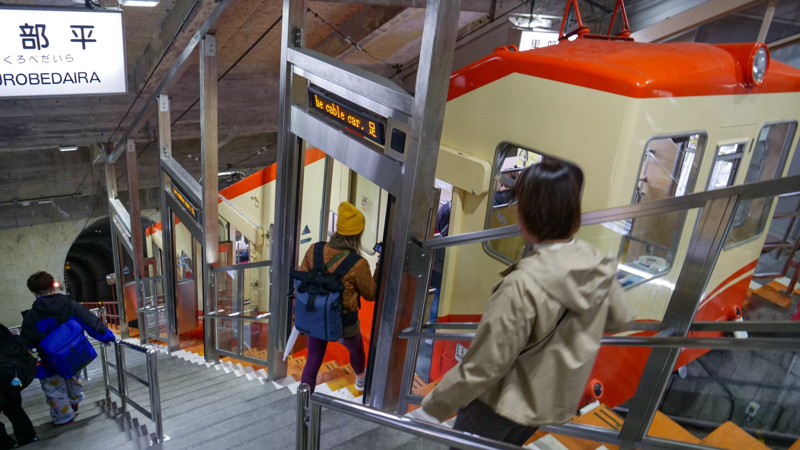 That Backpacker Audrey Bergner boarding the Kurobe Cable Car for unique underground travel from Kurobedaira to Kurobeko 