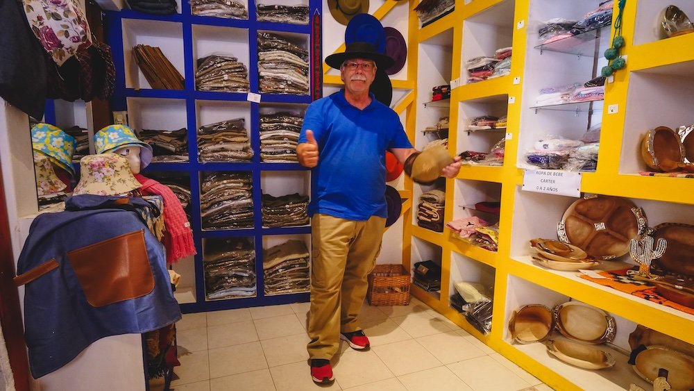 That Backpacker Audrey Bergner buying a hat for Daniel Bergner at the indigenous market in Chicoana, Salta, Argentina 