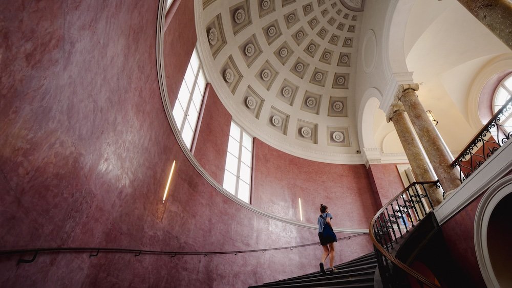 That Backpacker Audrey Bergner climbing a grand staircase at Munich Residence Former Royal Palace in Munich, Germany