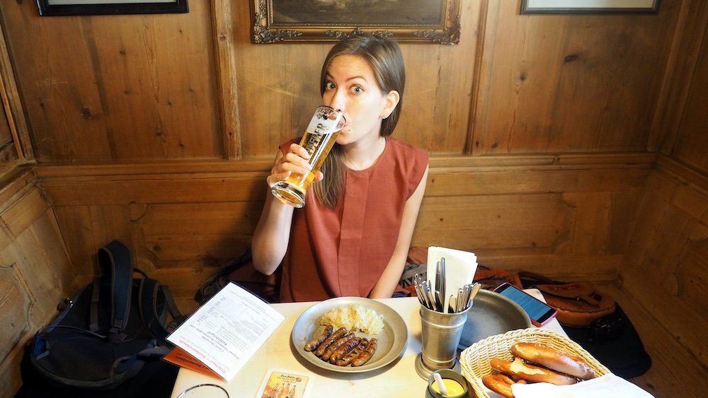 That Backpacker Audrey Bergner enjoying a pint of German beer and food in Nuremberg, Germany 