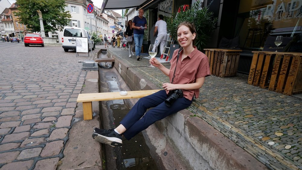 That Backpacker Audrey Bergner enjoying wine and snacks on the street in Freiburg, Germany 