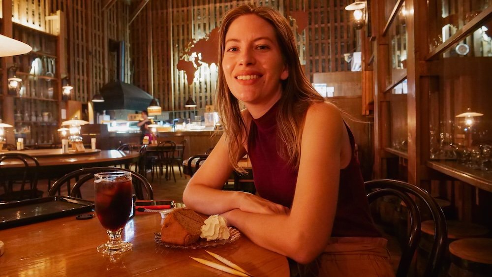 That Backpacker Audrey Bergner having cake and drinks at the Kitaichi Hall Gas Lamp Cafe in Otaru, Japan 