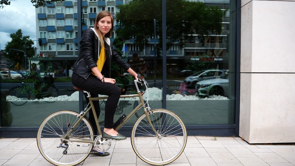 That Backpacker Audrey Bergner riding a bike in Dusseldorf, Germany 