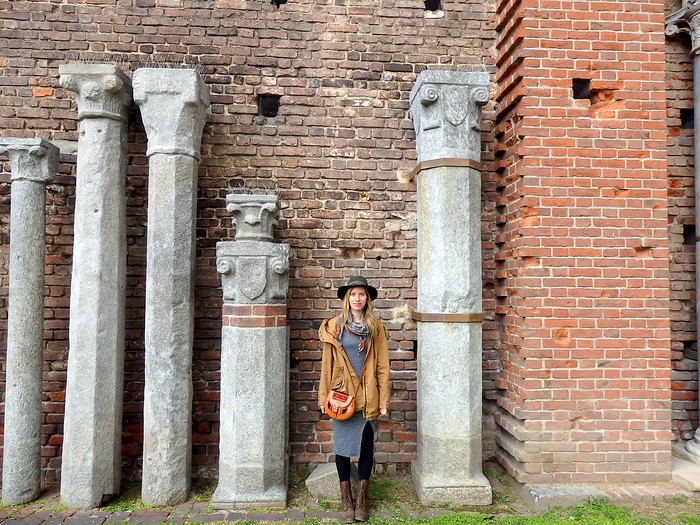 That Backpacker (Audrey Bergner) standing beside column ruins at Sforza Castle in Milan, Italy