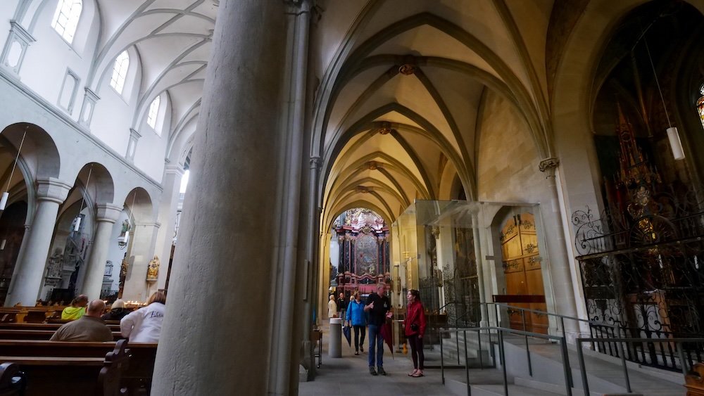 That Backpacker Audrey Bergner taking a walking tour of Konstanz city inside of a cathedral in Lake Constance, Germany 