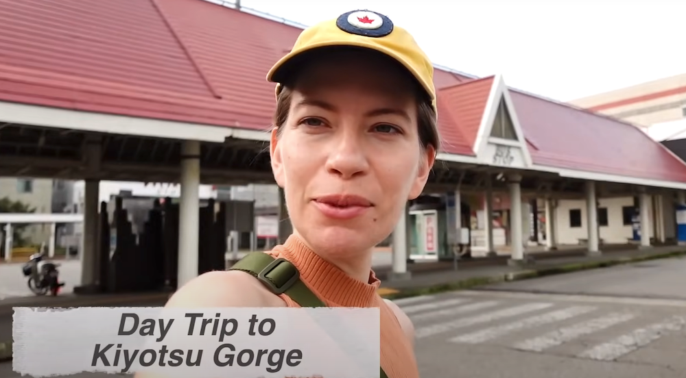 That Backpacker Audrey Bergner waiting at the bus stop for a day trip to Kiyotsu Gorge, Japan